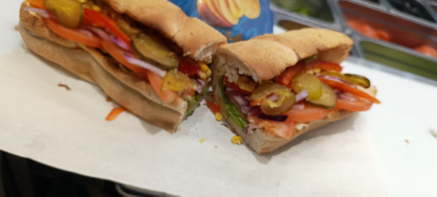 Freshly made sub cut in half with salad